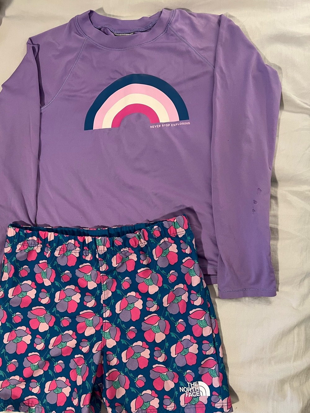 The North Face Purple Rainbow Long-Sleeve SwimTop with Blue Floral Swim Shorts